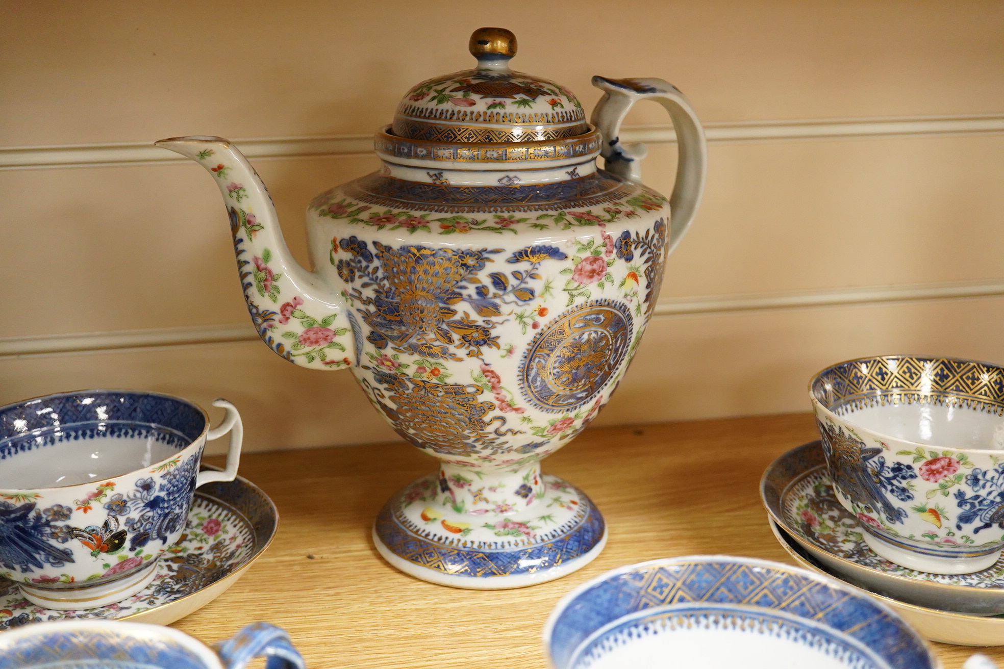 An early 19th century Chinese porcelain part tea set and matching sauce boat - teapot 25cm high